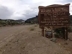Sign at the west entrance to Ione
