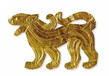 Gold plate in the form of walking feline found in Majiayuan M3, Gansu.