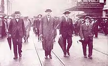 Actors' Equity president Francis Wilson marching down a street with other Actors' Equity leaders
