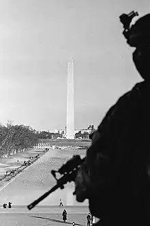 Image 7Photograph of a National Guardsman looking over the Washington Monument in Washington D.C., on January 21, 2021, the day after the inauguration of Joe Biden as the 46th president of the United States (from Photojournalism)