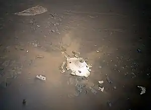 Image 68Perseverance's backshell sitting upright on the surface of Jezero Crater (from Space debris)