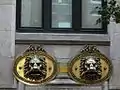 The two lion's head mailboxes
