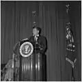 Austin (left) listens to President John F. Kennedy speak at the Naval War College on 27 September 1961.