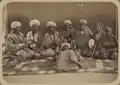 The same group of musicians. The boys are posed with their instruments (tas and kairak) on the right.
